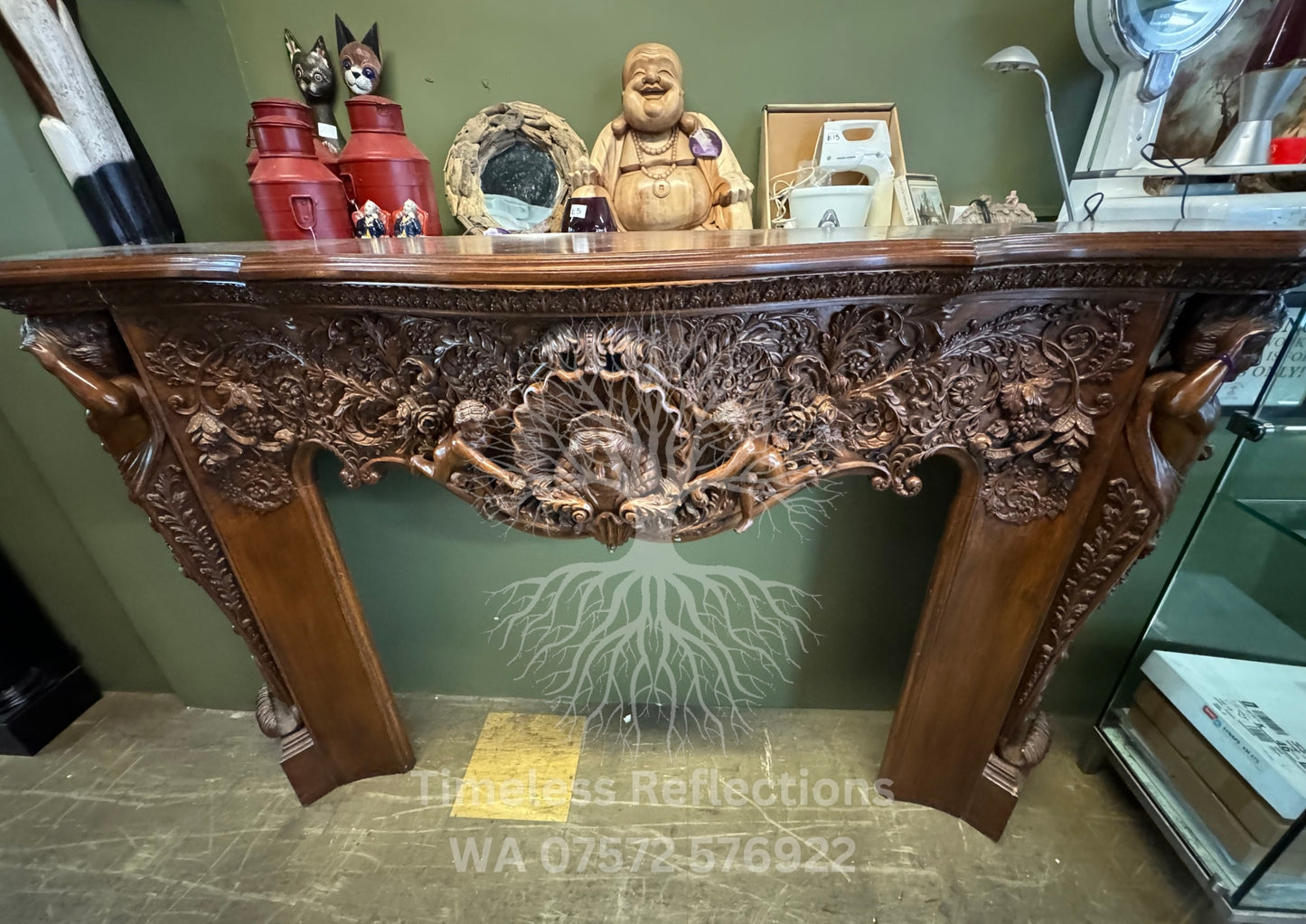Exquisite Hand-Carved Wooden Fireplace Mantel with Cherubs and Floral Motifs