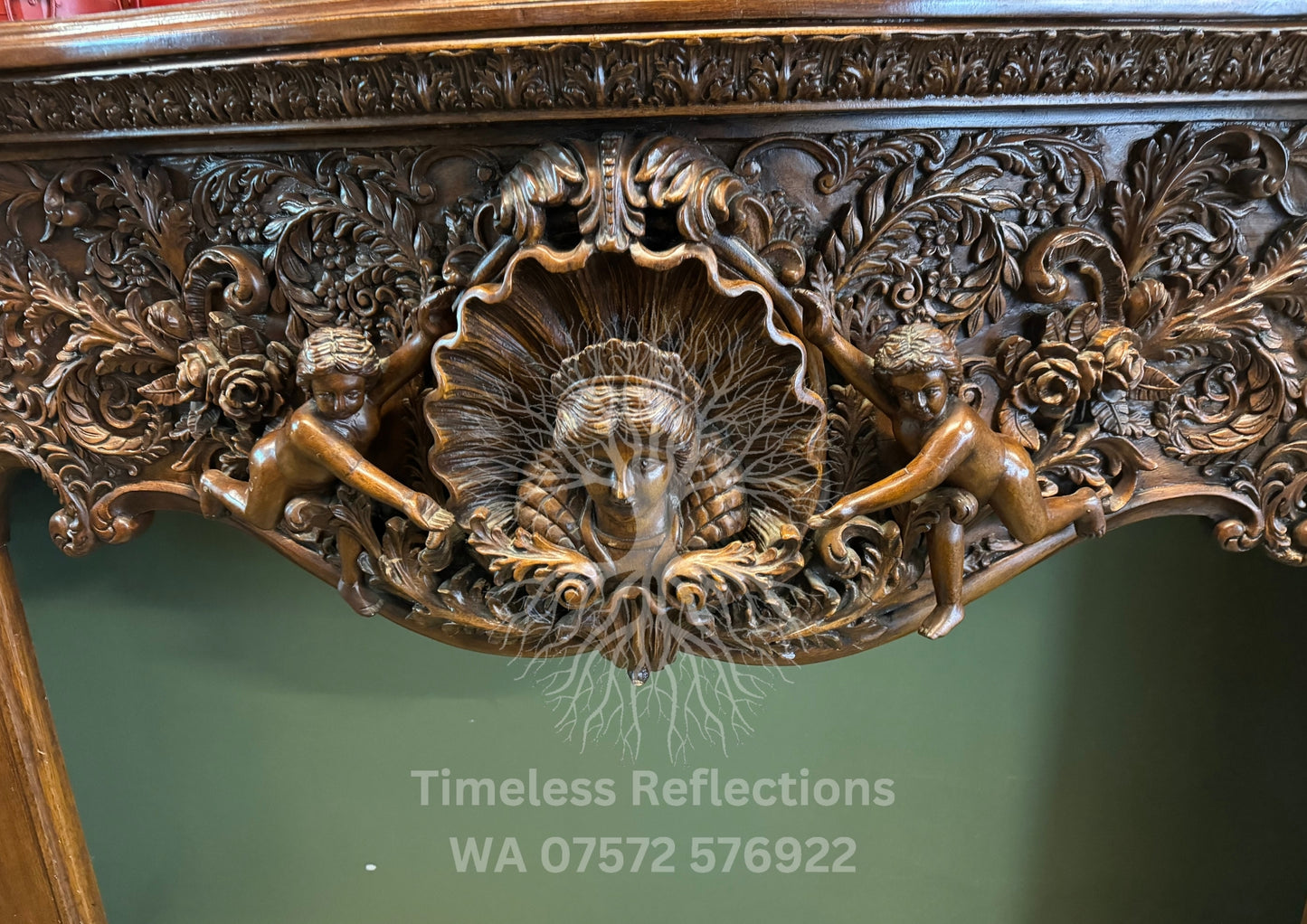 Exquisite Hand-Carved Wooden Fireplace Mantel with Cherubs and Floral Motifs