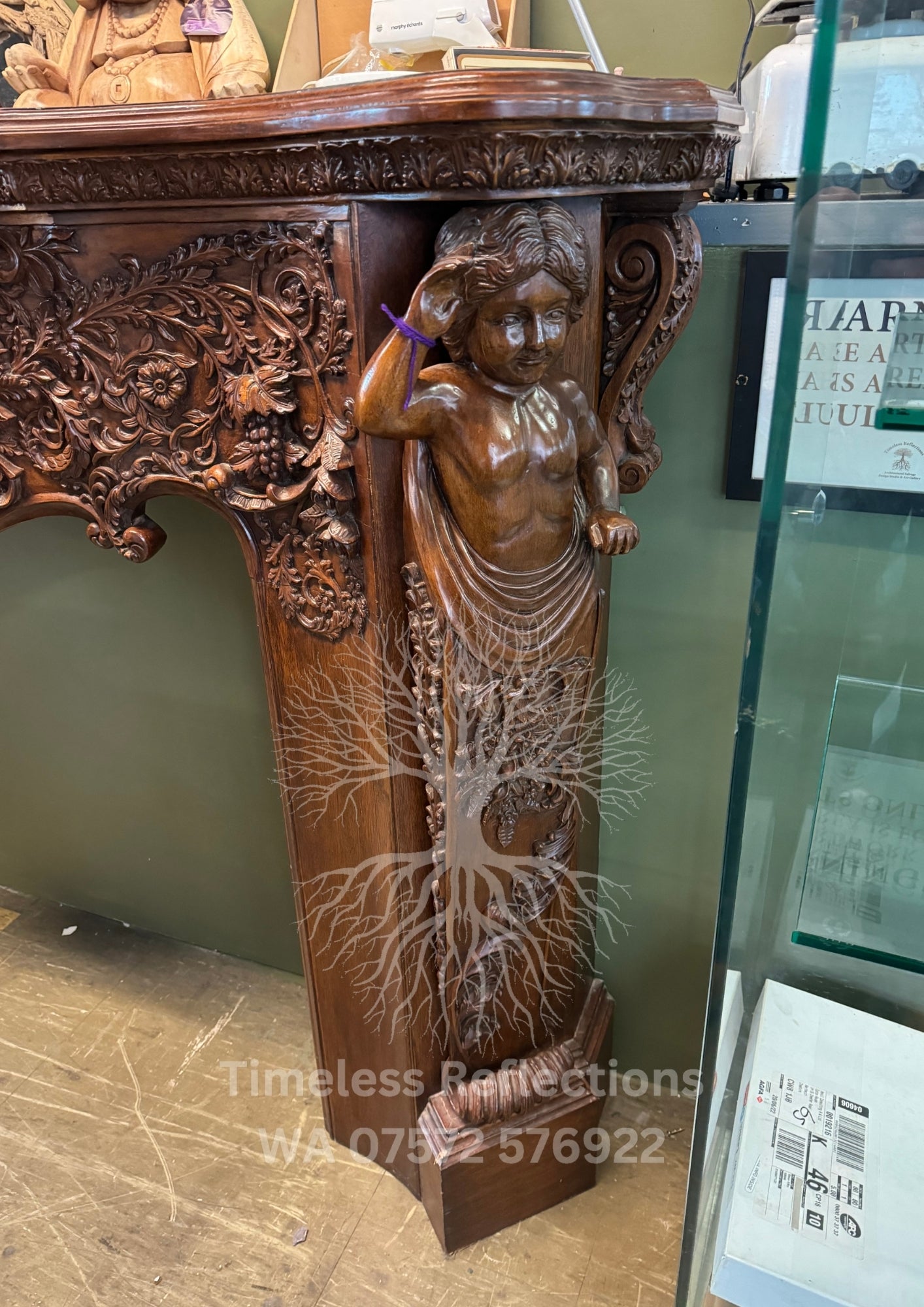 Exquisite Hand-Carved Wooden Fireplace Mantel with Cherubs and Floral Motifs