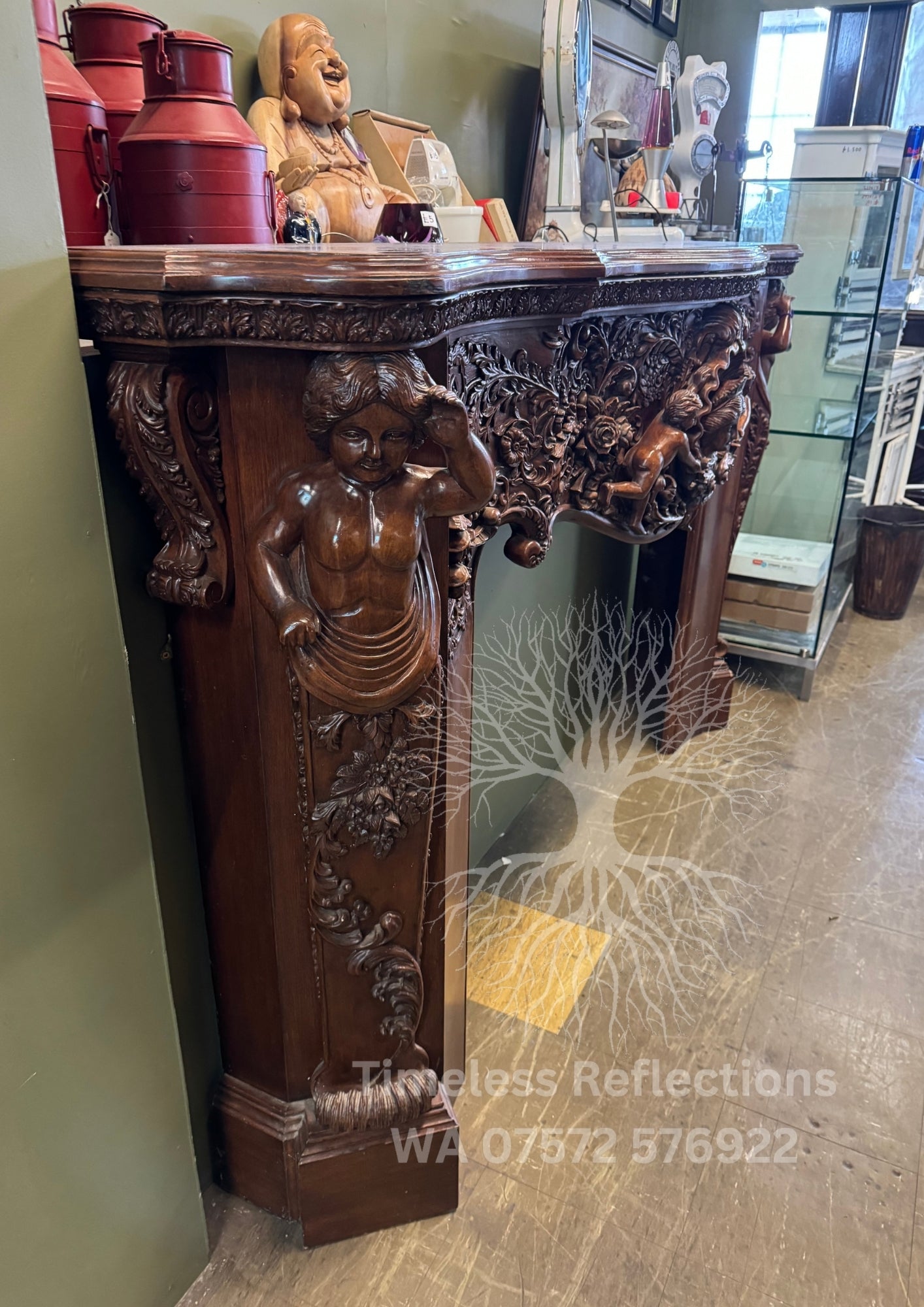 Exquisite Hand-Carved Wooden Fireplace Mantel with Cherubs and Floral Motifs