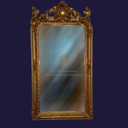 The Cherub Adorned Gilt Mirror